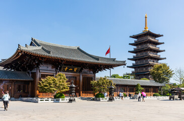 Shanmen and pagoda of historic Baoshan or Treasure Mountain Serene Temple, a Buddhist temple on banks of Lianqi River at  Luodian Town, Baoshan District, Shanghai, China.