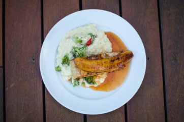 Grilled salmon with rice and herbs
