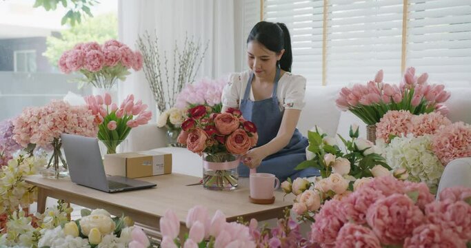 Asia people SME woman tied bow sell flower gift product wrap parcel send by same day sale order fulfilment dropshipping postal solution. Happy job work at home business workspace in digital store.