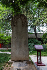 A tall historic stele in Stele Forest or Beilin Museum, Xi'an, Shaanxi, China, for steles and stone sculptures of Chinese caligraphy, paiting and historic records. Heritage.