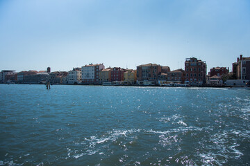 Fototapeta premium Venice, Italy 2019 boats near the docking stations on the canal
