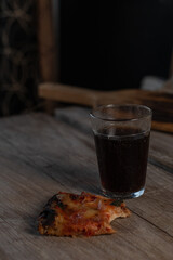 glass vine and pizza on the table