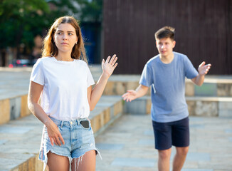 Young lady and her boyfriend are having a quarrel
