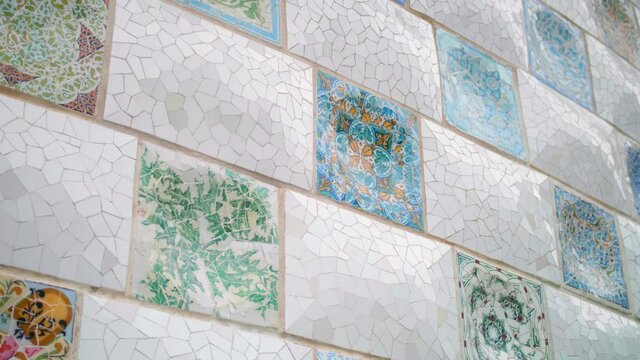 Beautiful mosaic tile details from a wall in Park G&uuml;ell in Barcelona, Spain -Close up