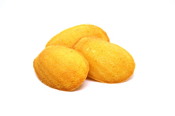 Fresh baked French Madeleines cake isolated on white background. Madeleines the small sponge cake with shell-like shape, famous French dessert