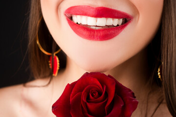 Fototapeta na wymiar Perfect Lips. Sexy Girl Mouth close up. Beauty young woman Smile. Beautiful woman lips with rose.