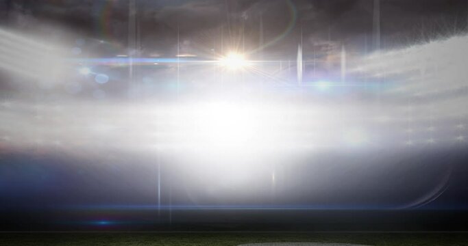 Animation of blurred moving lights and bokeh light spots at floodlit sports stadium