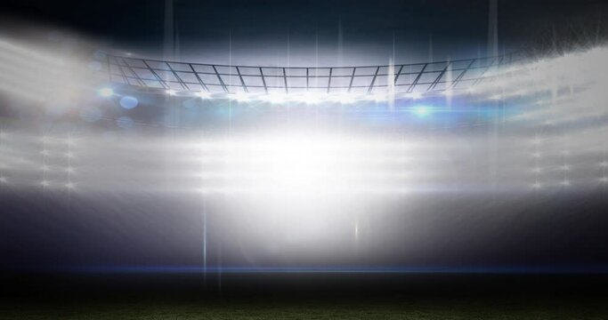 Animation of blurred moving lights and bokeh light spots at floodlit sports stadium