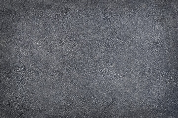 Black colored granulated material texture asphalt  close up top view black background