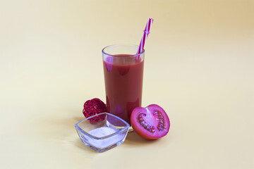 Tomato juice with a red tube, red tomato and salt on a yellow background