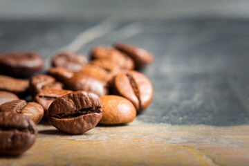close up of coffee beans on concrete background