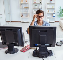 Young trader monitoring markets on screens