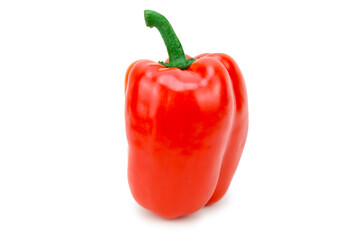 Red bell pepper fruit standing upright with a green pod on top