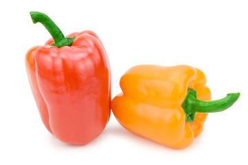 Two sweet bell peppers, red and orange, with green pods