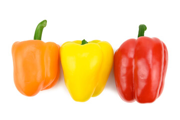 An overhead view of three multi-colored sweet bell peppers lying on their side