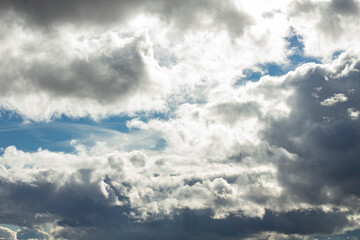 Beautiful sky landscape with dramatic clouds and bright sunspots