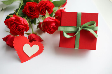 romantic greeting card happy valentine's day. red heart, gift box and a bouquet of flowers 
