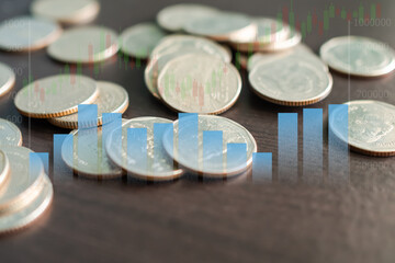 Stack coin with Graph sybols, candlestick chart stock market and bokeh background. planing earn cash investment from trade forex and saving money future for 2022 new year. finance and business.
