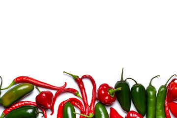 Different types of hot peppers border, top view, place for text, copy space.