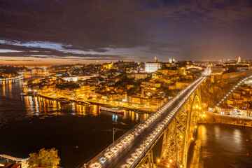View of Porto with the river Douro and the Dom Luis I bridge at night