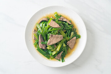 Stir-fried onion flower stem with pork liver