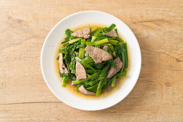 Stir-fried onion flower stem with pork liver