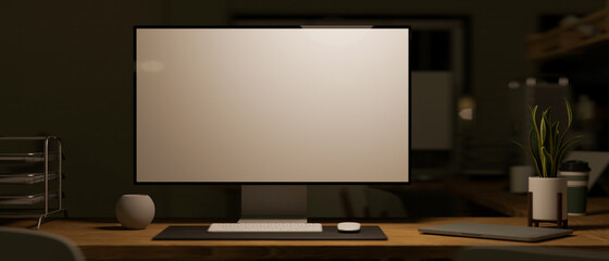 Modern pc computer white screen mockup in dark office room.