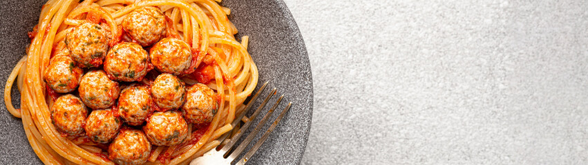 Close-up plate SPAGHETTI MEATBALLS Like an Italian with copy space banner