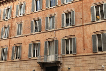 Fototapeta na wymiar Palazzo degli Stabilimenti Spagnoli Building Facade with Windows and Grey Shutters in Rome, Italy