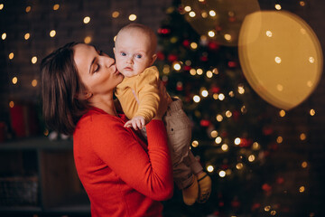 Mother with her baby boy celebrating christmas