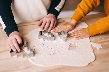 boy's hands baking christmas cookies
