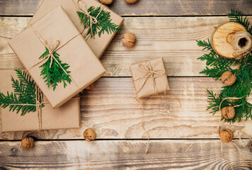 Boxes packed with kraft paper and natural twine on a wooden background.Eco-friendly material.Christmas and New Year.