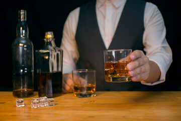 Barman pouring whiskey whiskey glass beautiful night