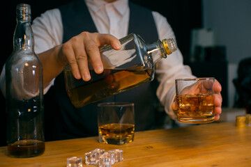 Barman pouring whiskey whiskey glass beautiful night