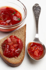 Spoon with tomato sauce. Tomato sauce sandwich.