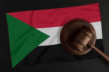 Judges hammer and the flag of Sudan. Law and Justice. Constitutional law