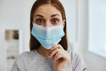 woman in medical mask face close up hospital health protection