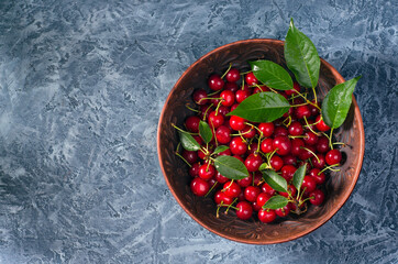 Plate with ripe cherries