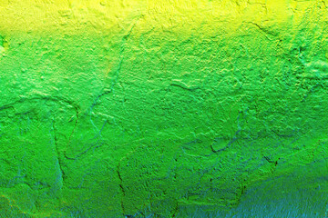 A fragment of colorful graffiti painted on a wall. Abstract urban background.