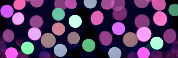 Multicolour bokeh orbs on black