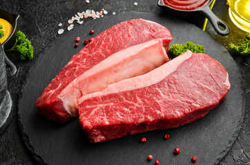 Raw fresh marble meat Black Angus Steak Ribeye on a dark background. Top view. Raw meat.