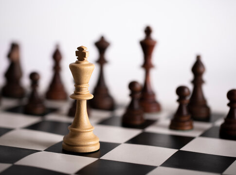 Chess pieces on a chessboard. The concept of playing and winning a chess tournament