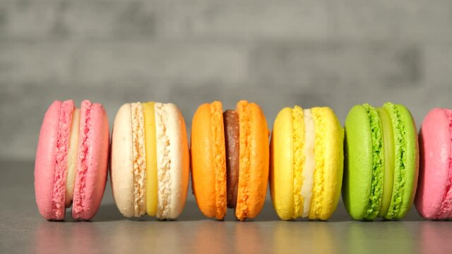 French macaroon dessert on the table. Row fo colorful french macarons.