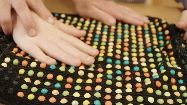 Touching the tactile mat of a child