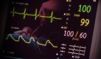 Patient monitor showing vital signs ECG and EKG. with a picture of a doctor doing surgery on the background