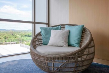 Empty brown plastic rattan sofa on the living room of the house