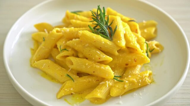 penne pasta with butternut pumpkin creamy sauce and rosemary