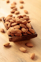 Almonds in a wooden dish.