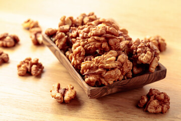 Walnuts in a old wooden dish.