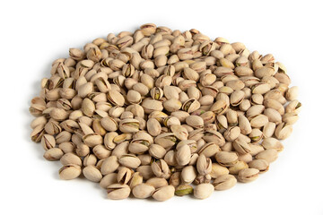 Pile of pistachios in the peel close-up on a white background. Isolated.